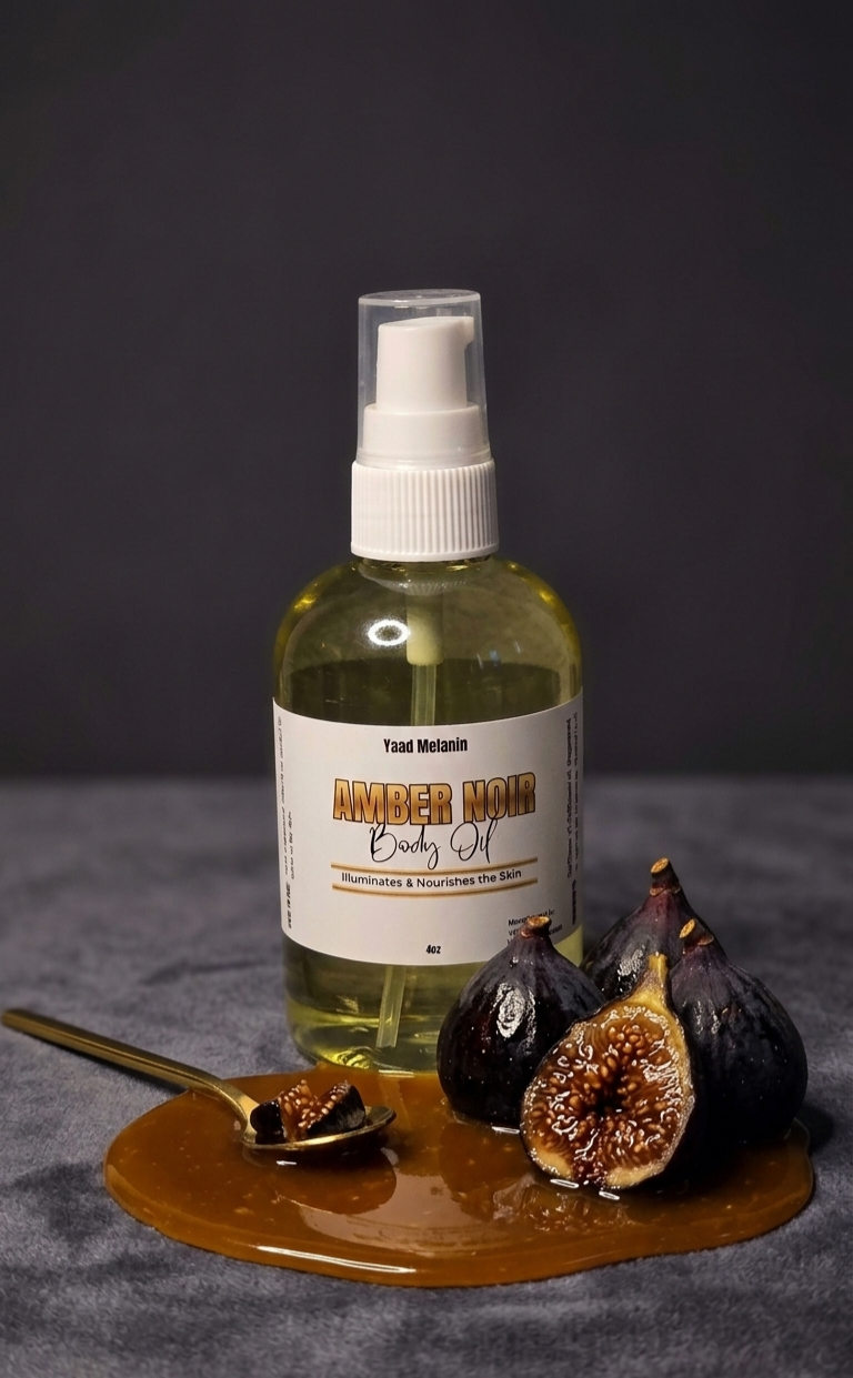 Bottle of amber noir body oil with figs and a spoon on a dark background