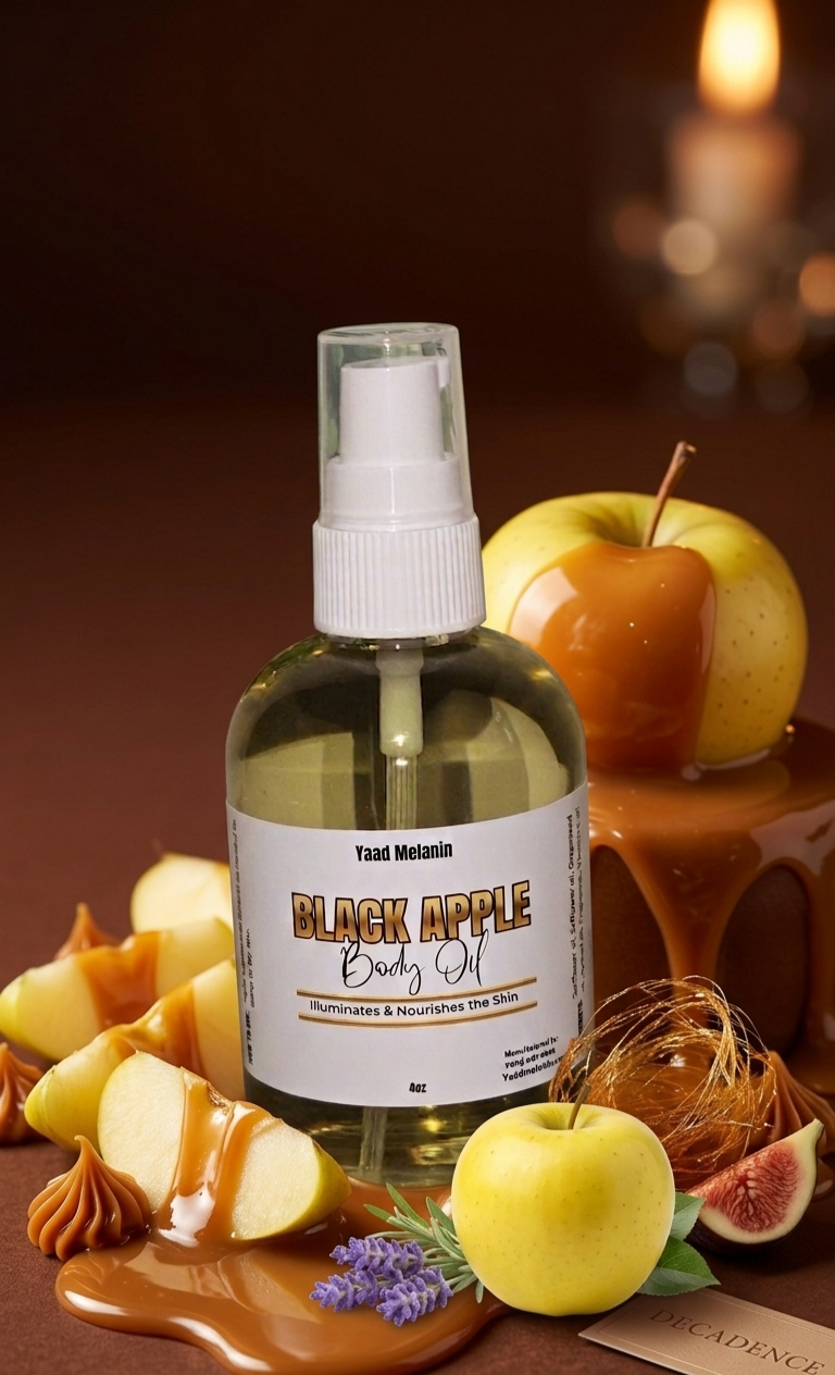Bottle of 'Black Apple' body oil with apples and caramel on a dark background